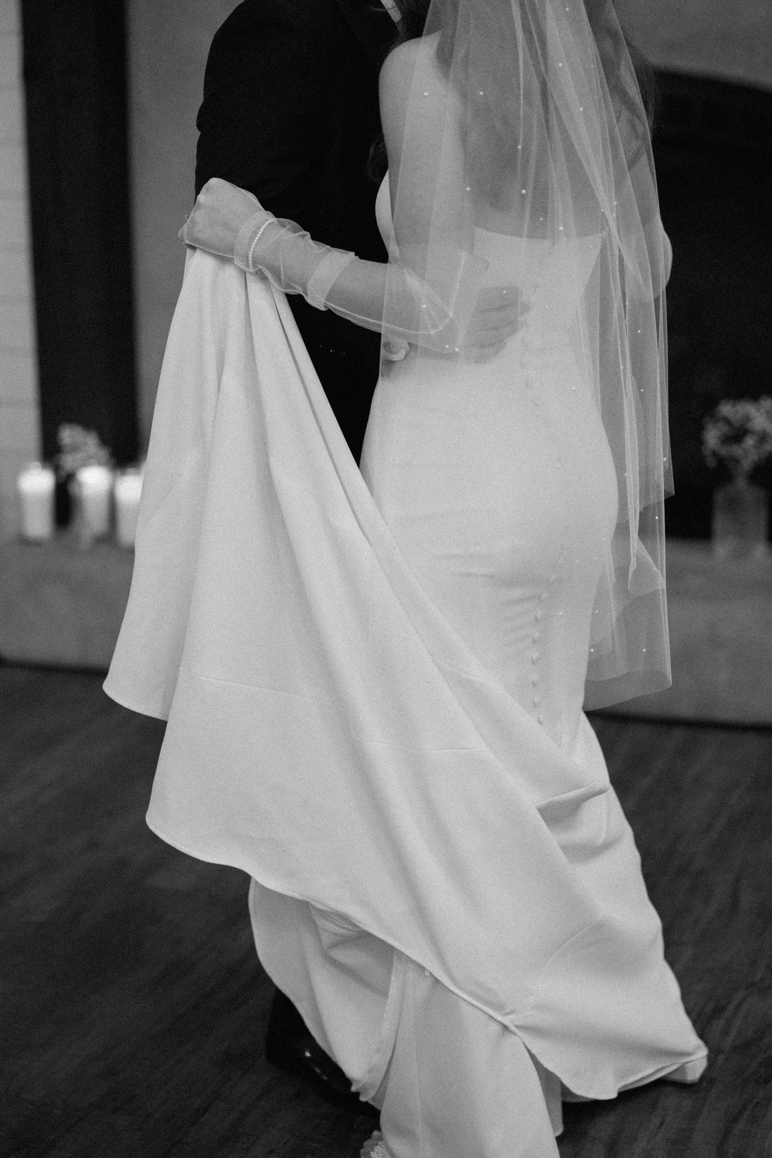 A series of black and white photos showing flowing white fabric and movement in what appears to be a wedding dress.