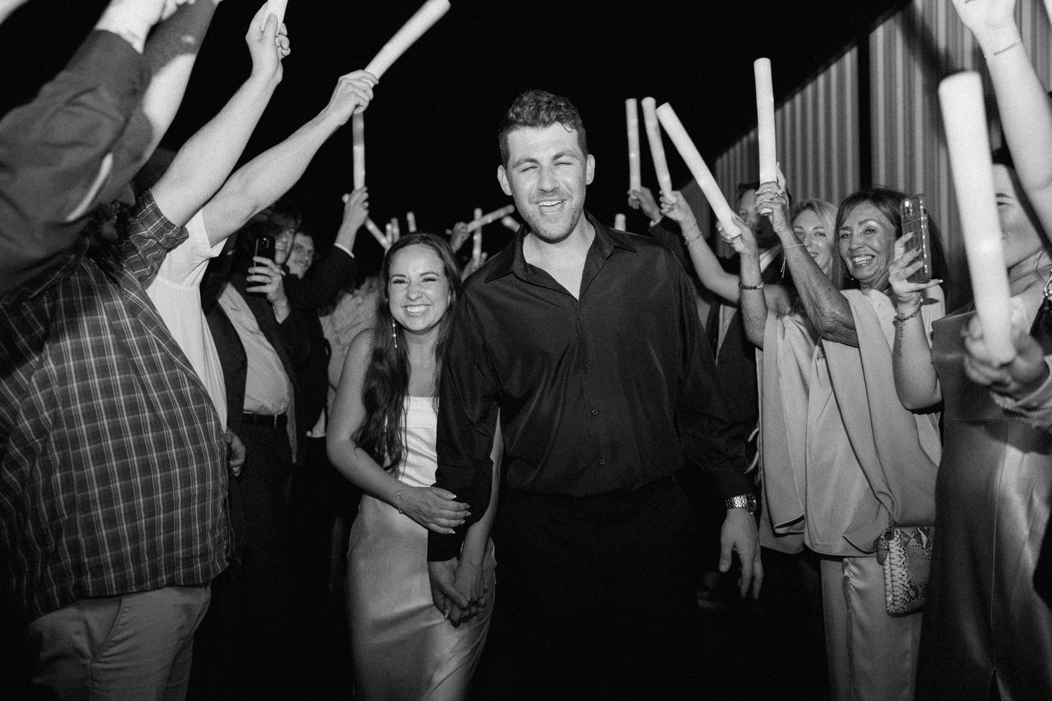 A series of black and white photos showing people dancing and celebrating at what appears to be a party or social gathering.