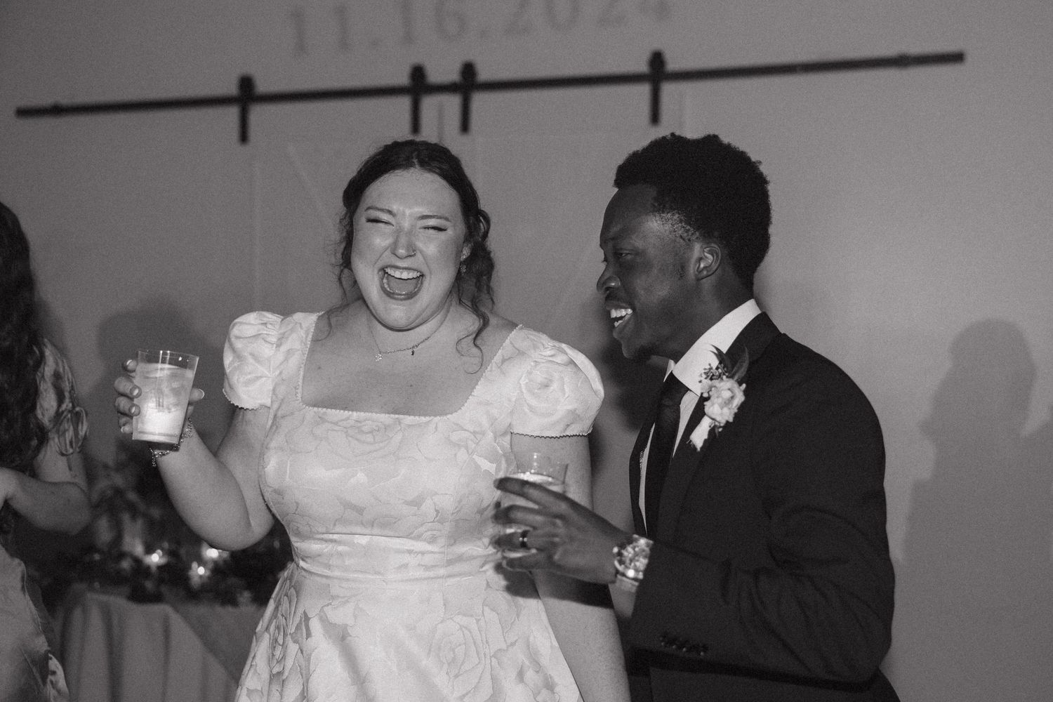 Black and white candid reception photos showing joyful celebration moments.