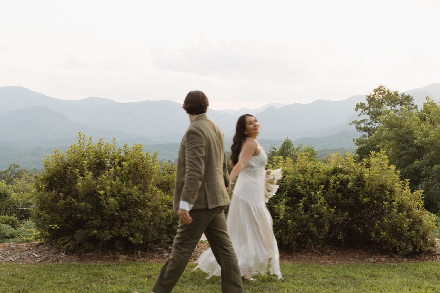 Scenic mountain landscape wedding photography with natural greenery.