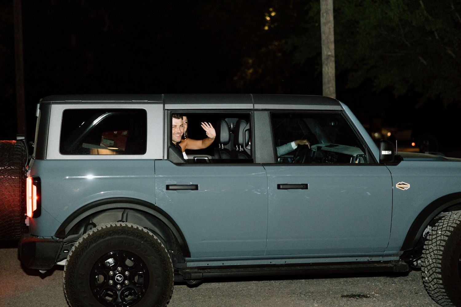 A collection of images showing a blue Land Rover Defender being driven on various off-road trails and paths.