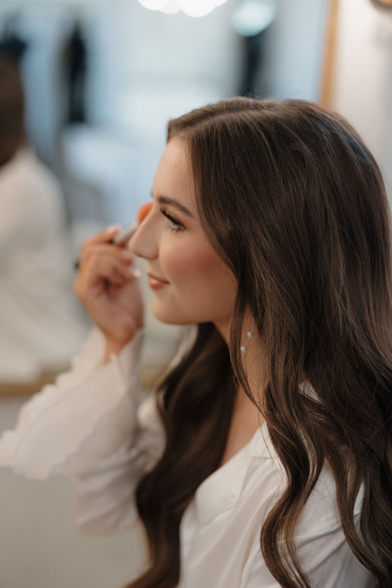 Side profile views showing soft wavy brunette hair styled in natural-looking waves with subtle highlights.
