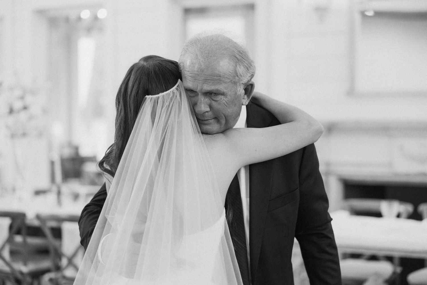 Black and white wedding photo series showing emotional father and daughter moments during a traditional ceremony.