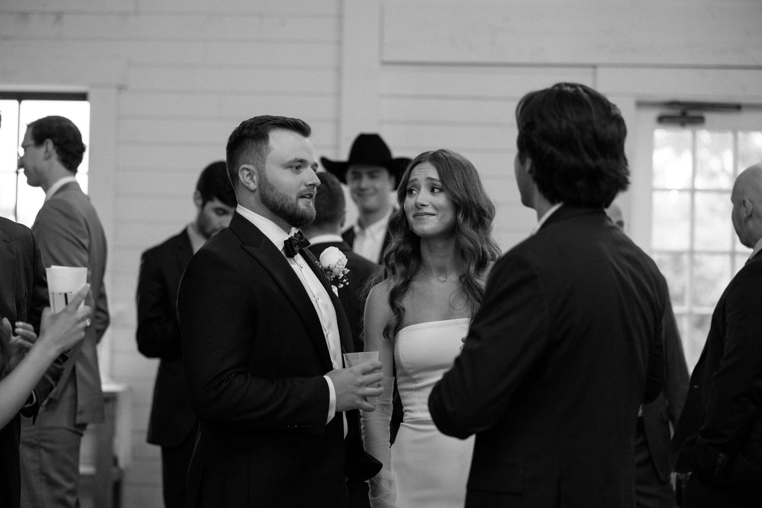 Black and white photo series showing intimate dance moments at what appears to be a wedding reception.