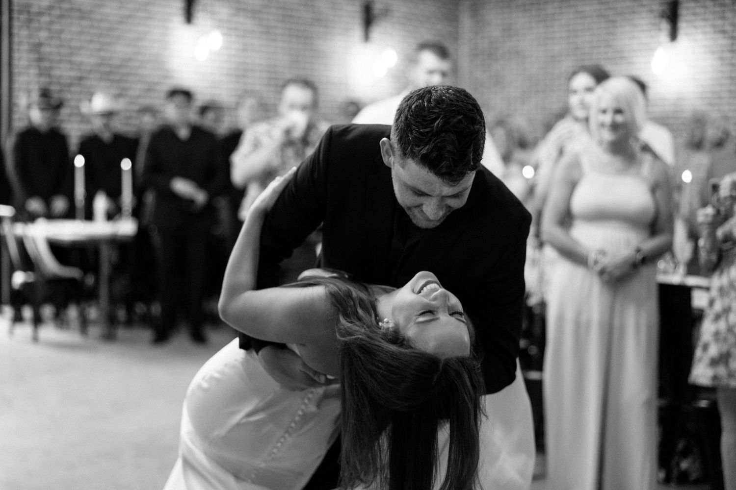 A black and white photo collage shows couples dancing together at what appears to be a wedding reception.