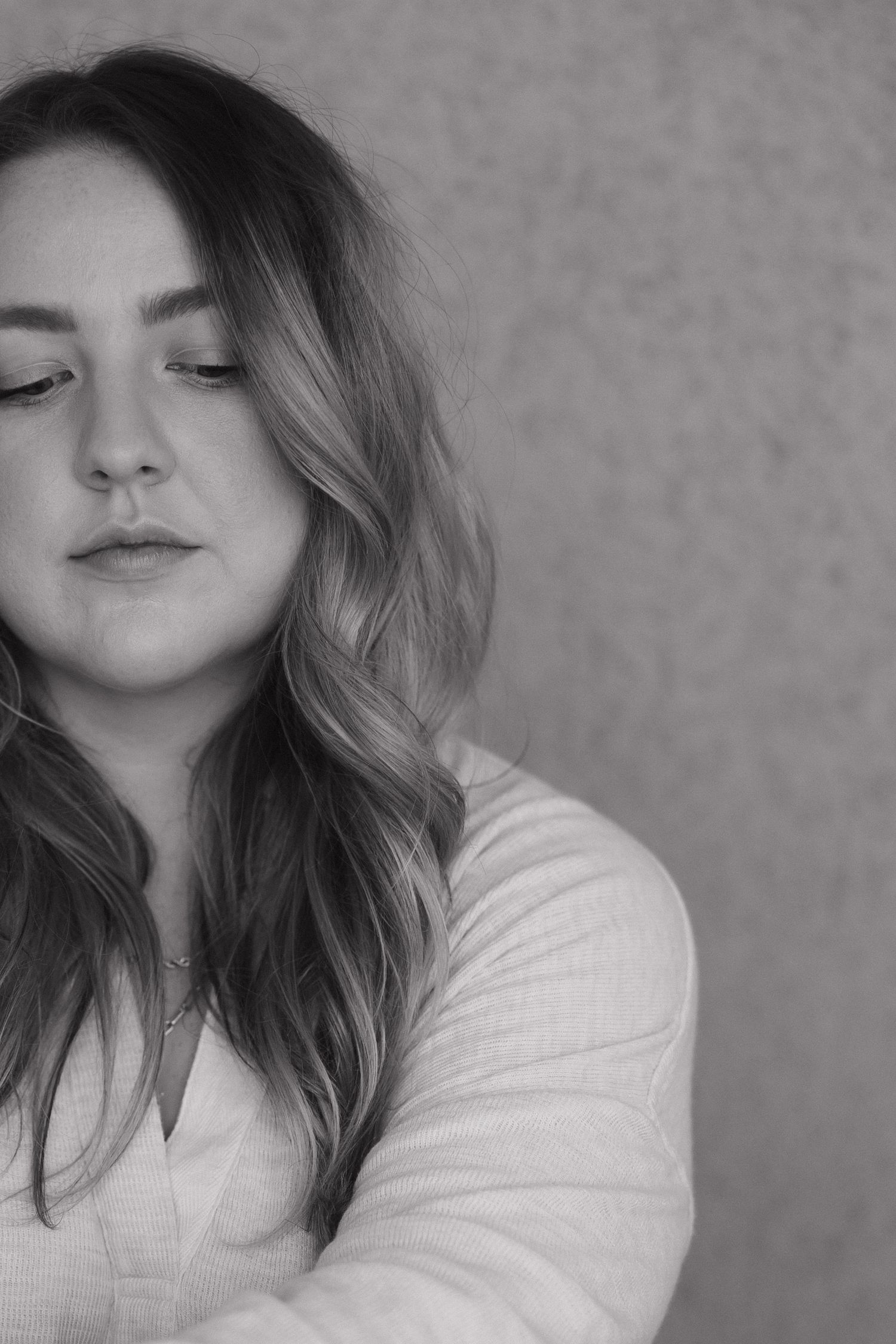 Black and white portrait series with dramatic lighting and soft expressions.