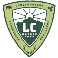 LC Nature Park shield logo featuring conservation, experience, and education themes with wildlife and nature imagery.