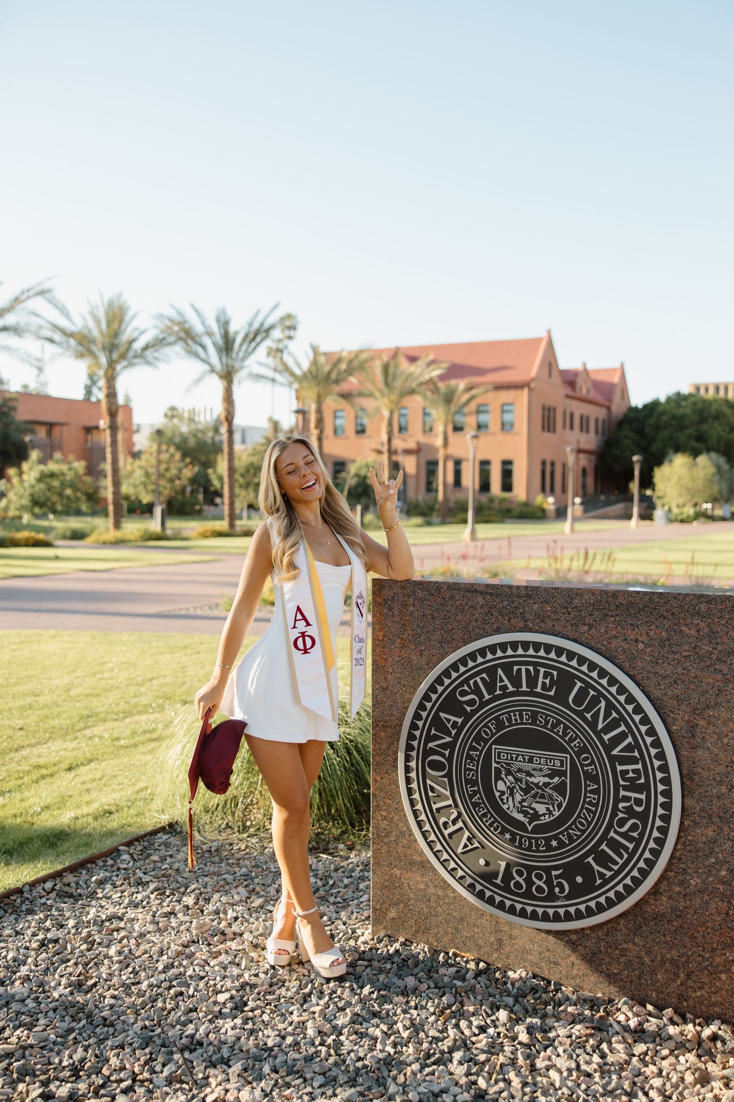 ASU graduate photographed in front of Old Main on the Tempe campus