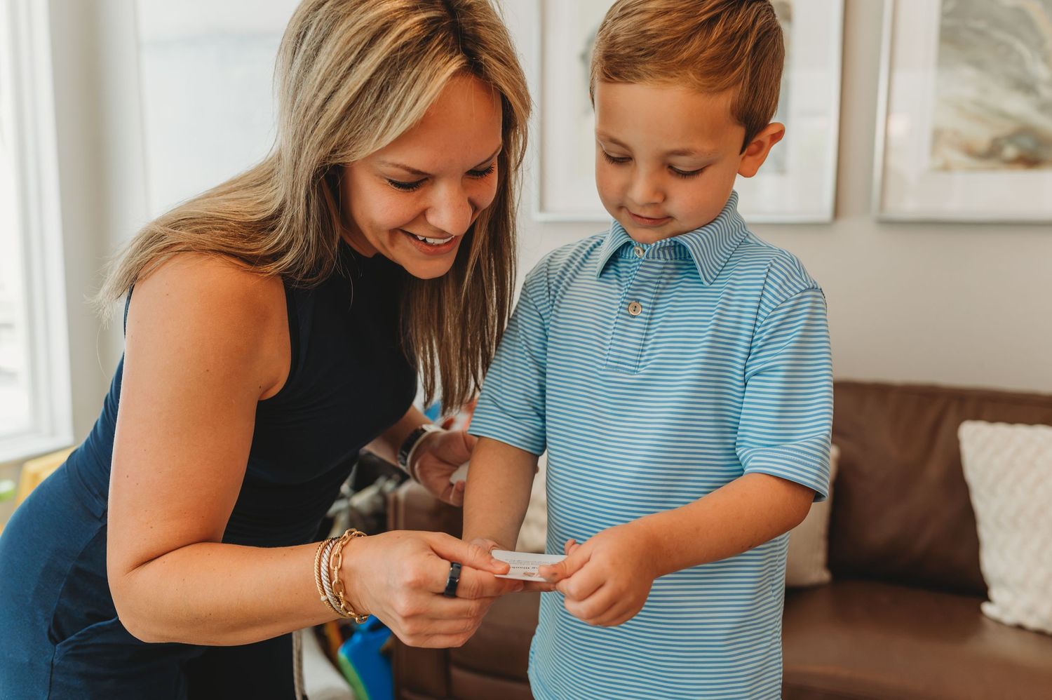 mother and son looking at Connect & Capture prompt deck during an in-home photoshoot in orlando fl