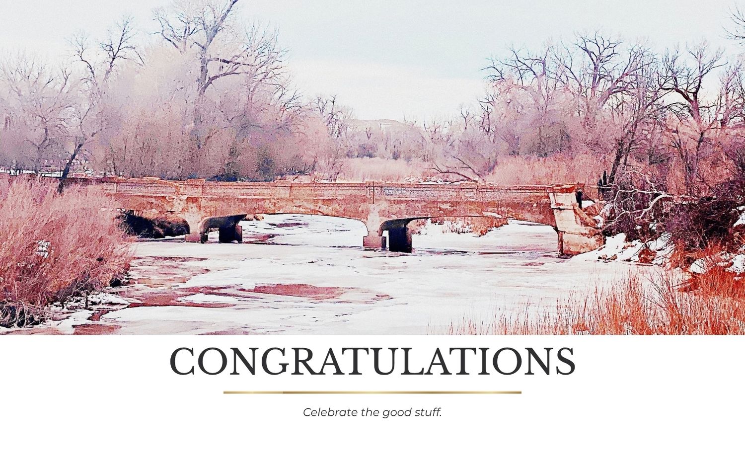 A congratulations card featuring a serene winter creek scene with snow-dusted trees and a rustic stone bridge.