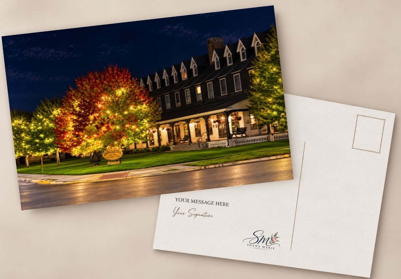 Night scene postcard featuring an illuminated historic building with colorful autumn trees and a blank message area on the reverse.