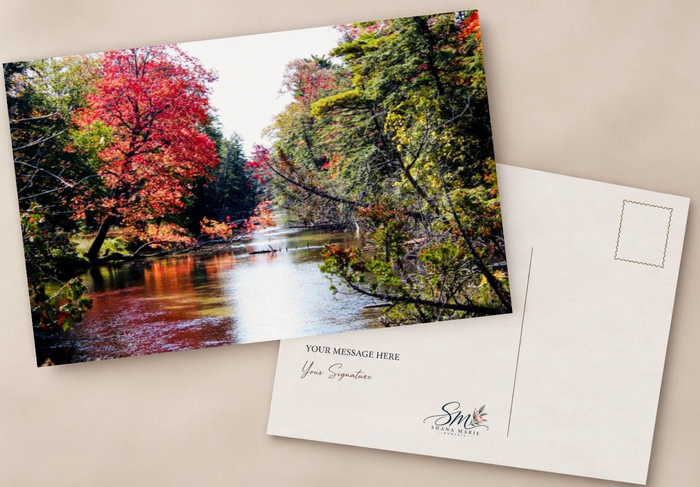 Autumn river scene postcard with vibrant red and green trees reflecting on calm water, featuring a customizable message and signature area.