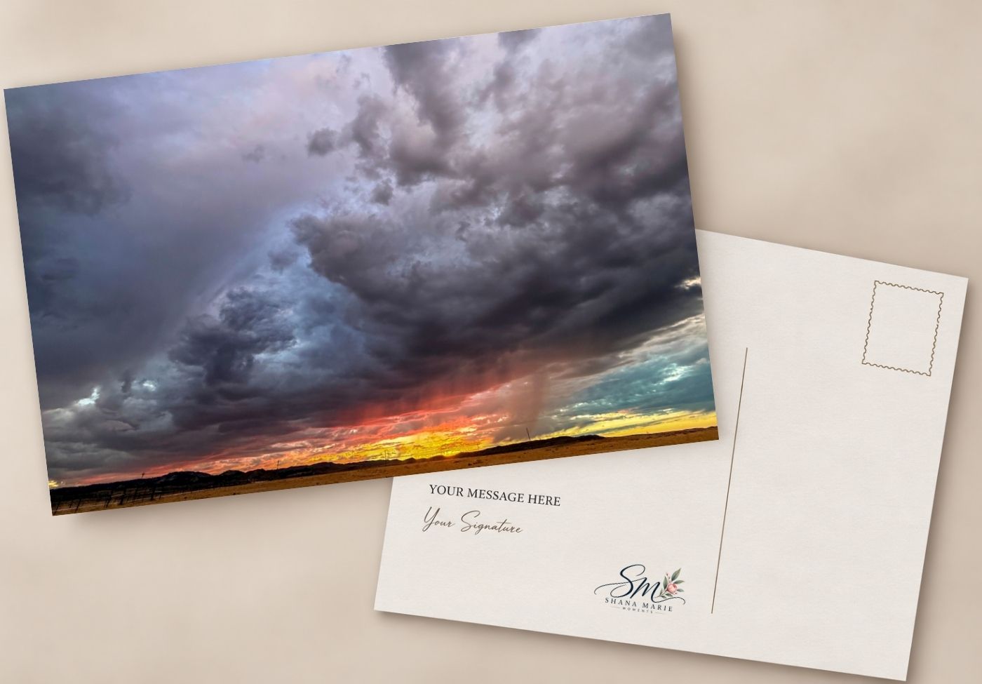 Dramatic stormy sunset postcard with dark swirling clouds over golden horizon, shown front and back with personalized message area.