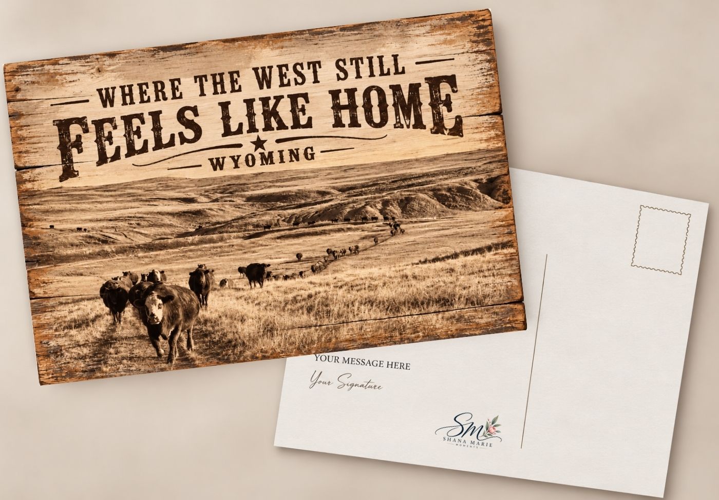 Wyoming postcard on wood background reads Where the West Still Feels Like Home with sepia cattle ranch landscape photo.
