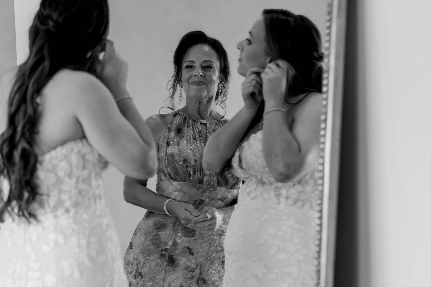 Black and white photos show intimate moments of preparation in a mirror.
