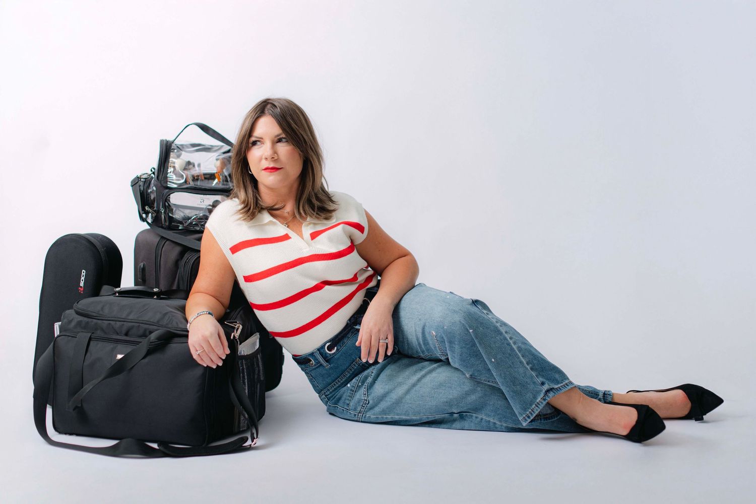 Lifestyle photography session showing casual poses with camera equipment.