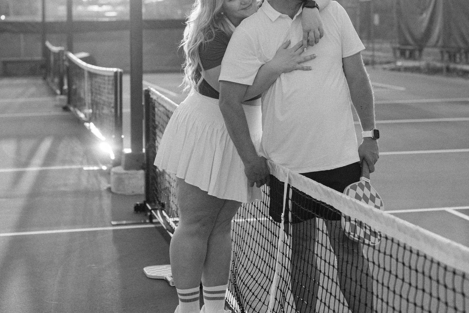 A series of black and white tennis photographs showing players shaking hands over the net after matches.