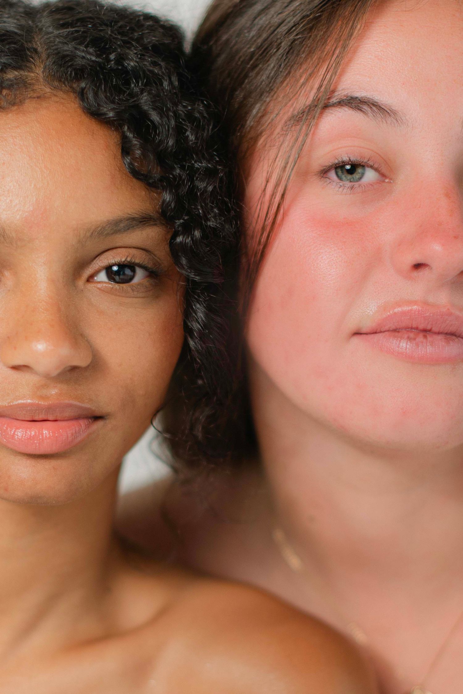 Beauty portrait series showing natural skin texture and features in warm lighting.