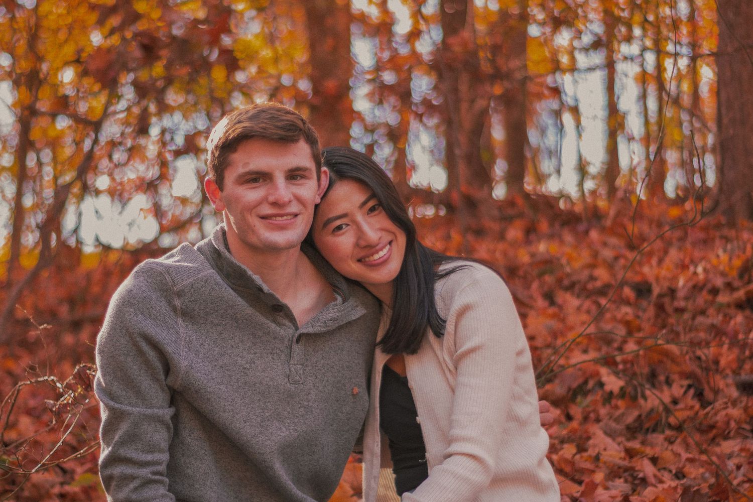 Couple sitting in autumn setting