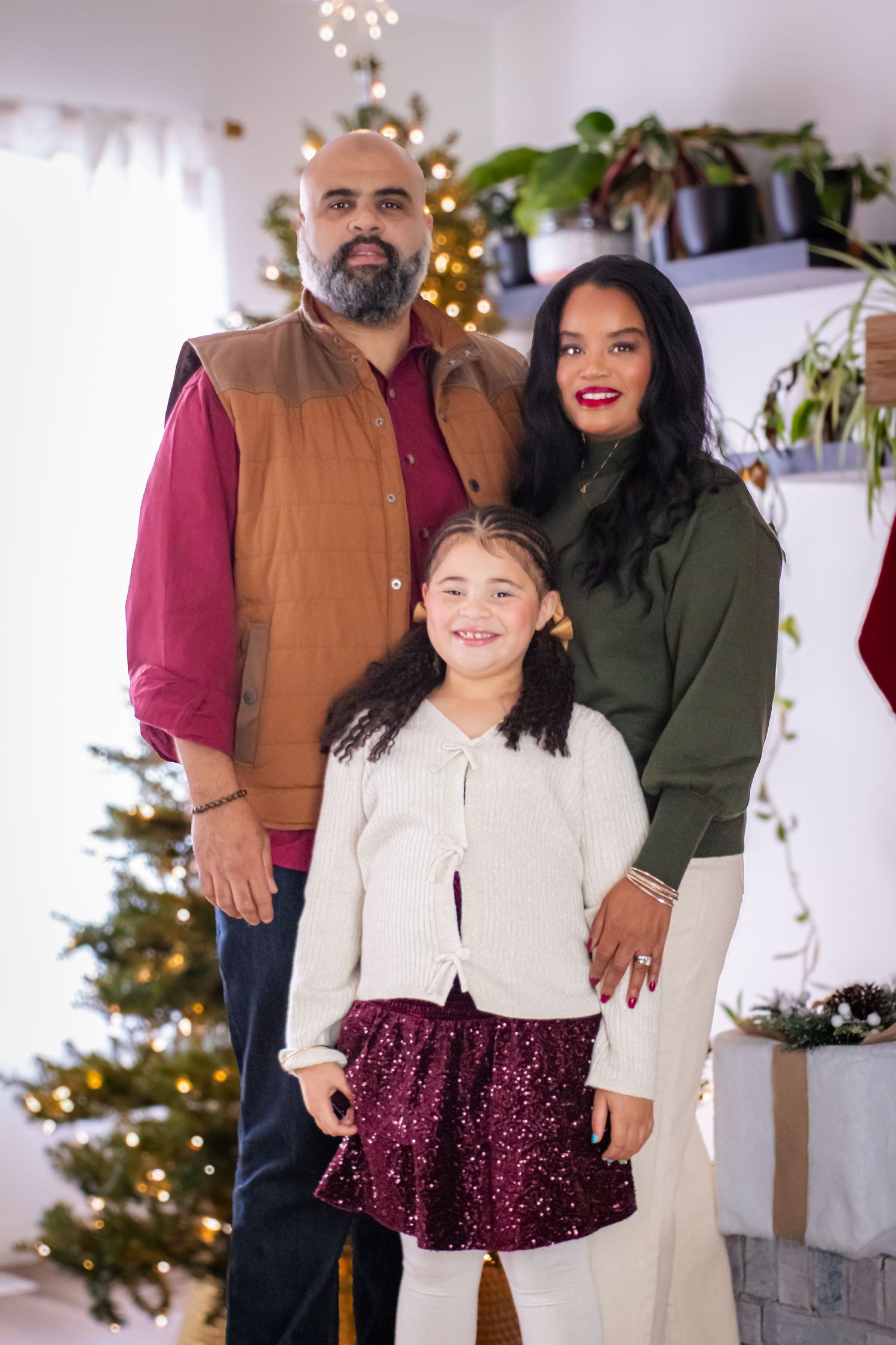 Family portrait in front of Christmas tree