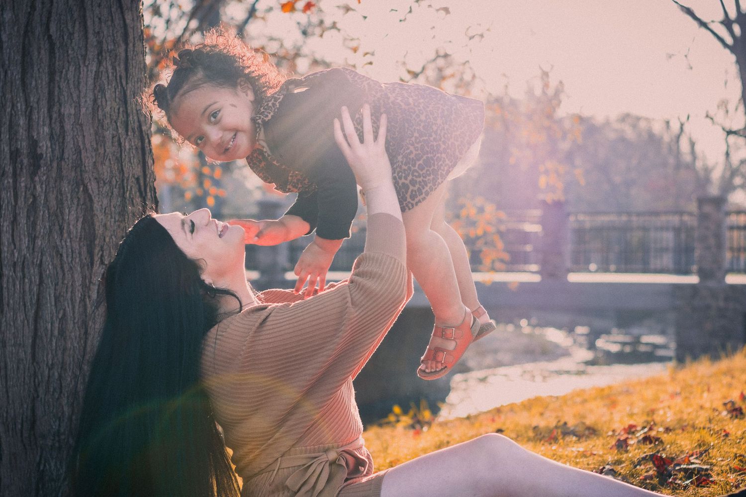 Mom and toddler sitting in the park