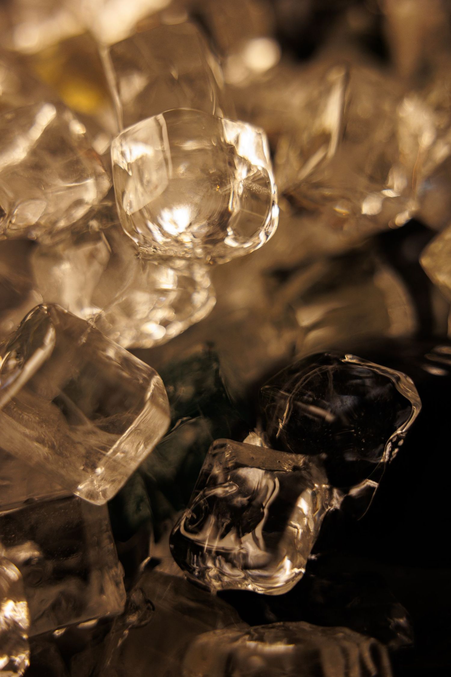 Close-up of illuminated crystal fragments creating abstract light patterns.