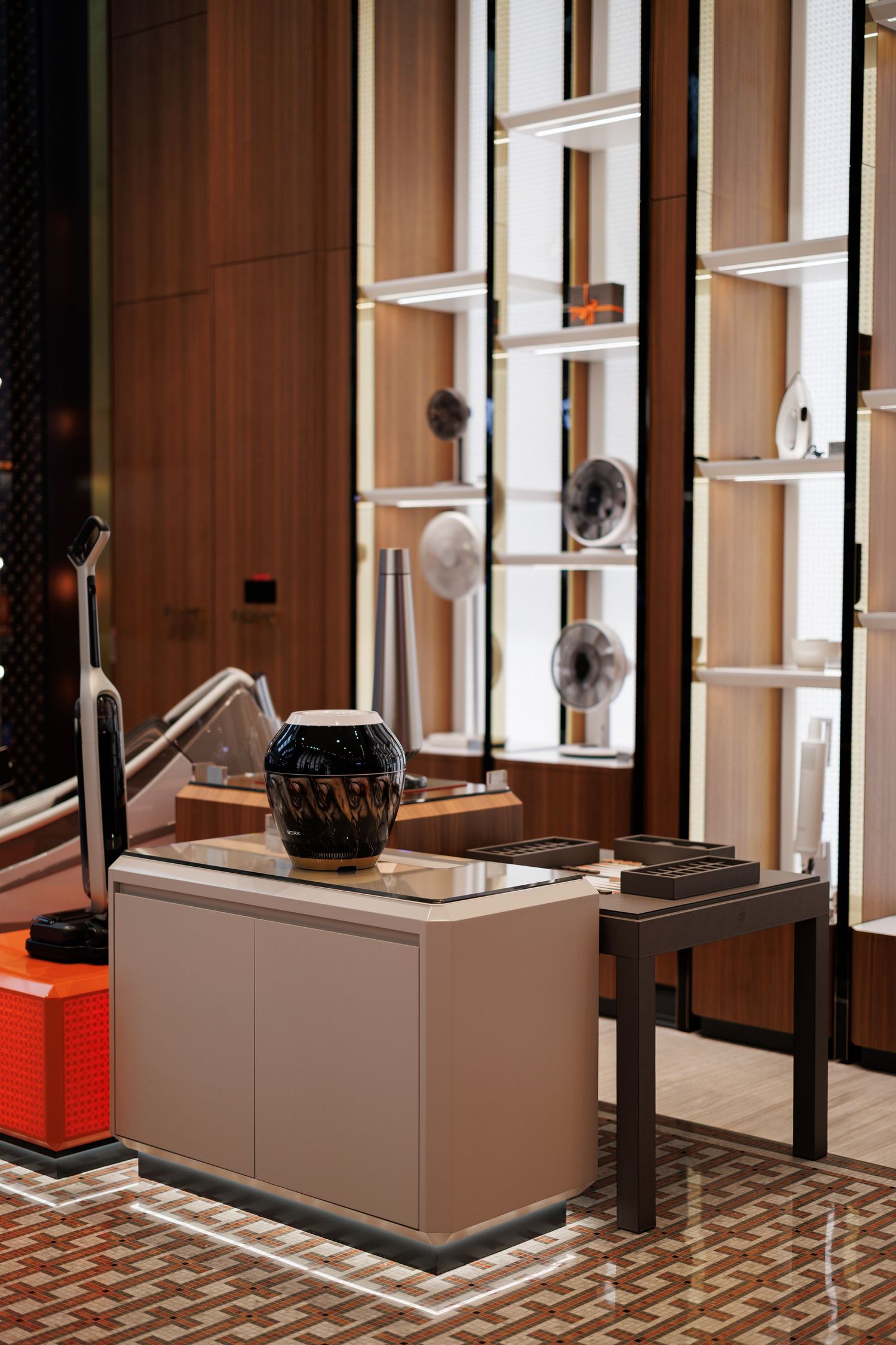 Sleek retail interior featuring wood paneling, display cases, and modern shelving units.