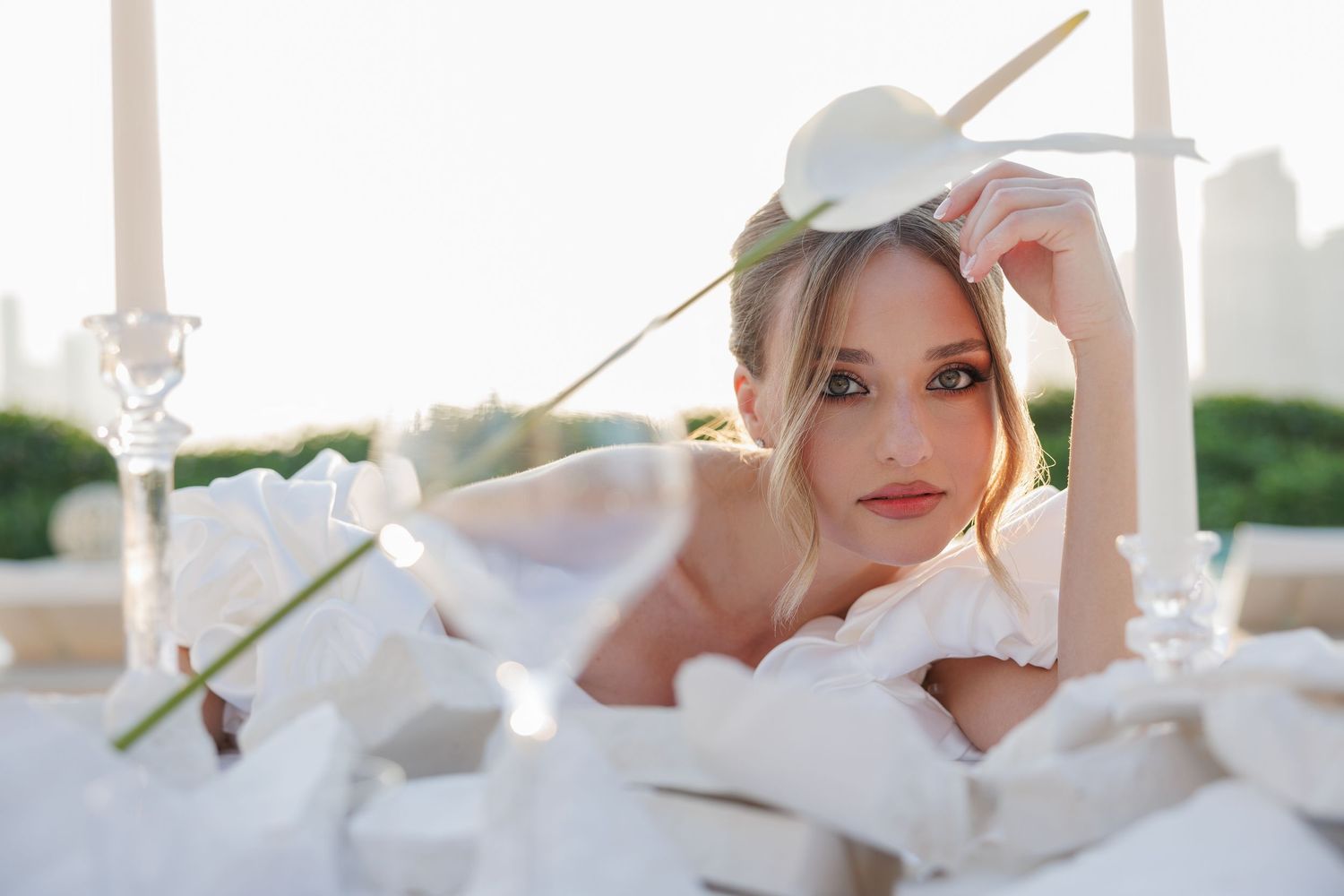 Romantic bridal portraits captured against a modern cityscape backdrop.