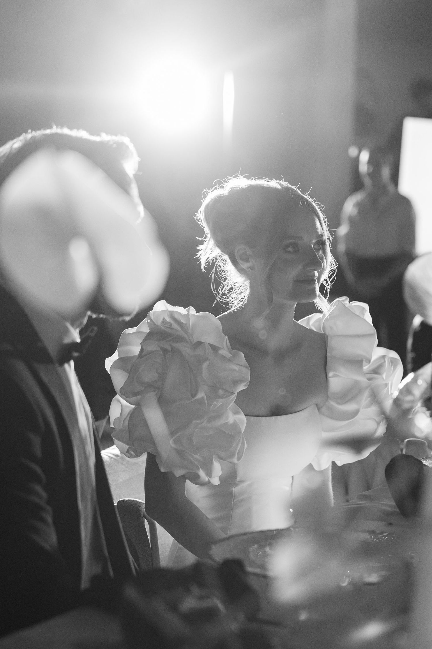 Guests enjoying champagne and conversation at an elegant evening reception.