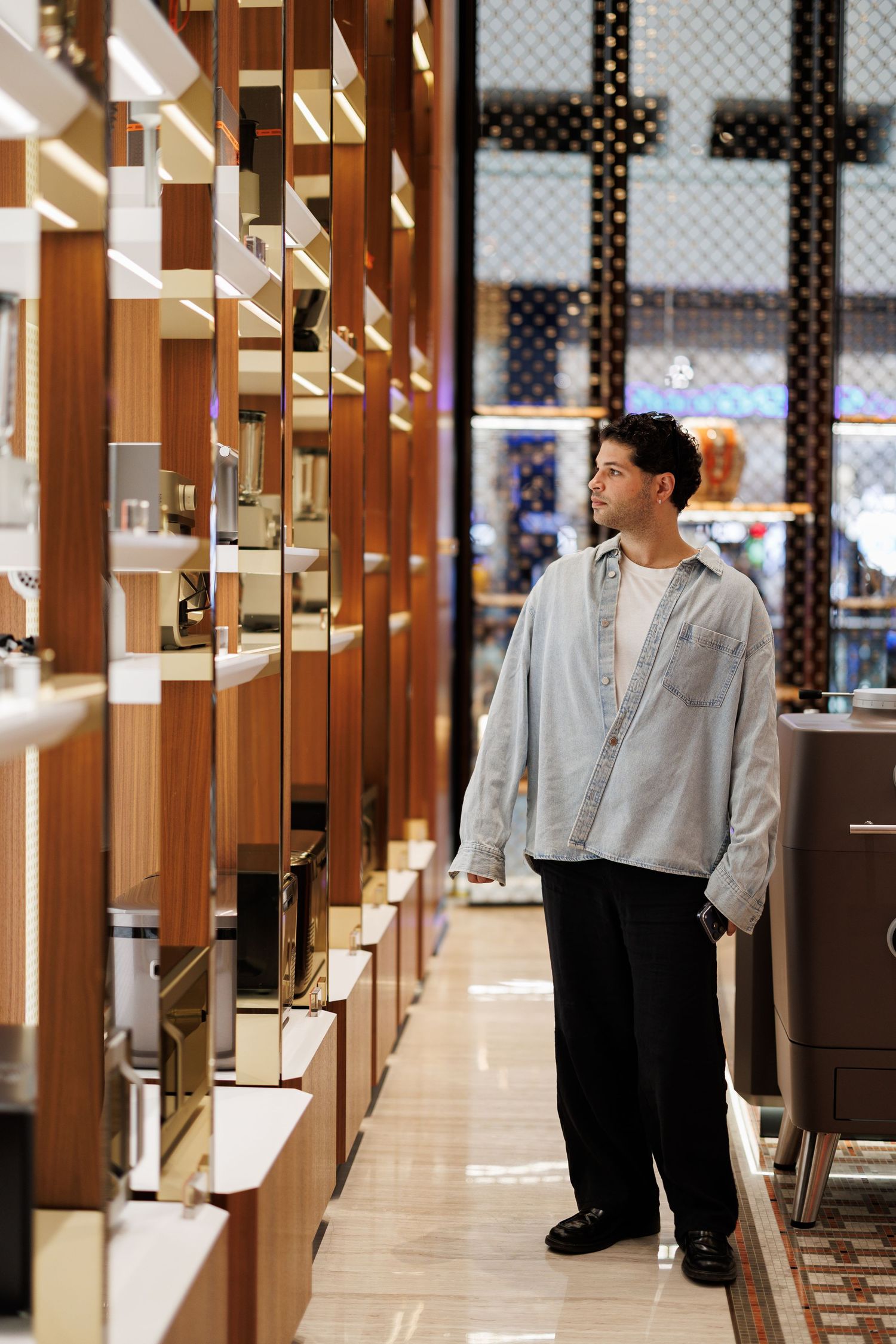 Modern retail interior with wooden panels and bright lighting creating an elegant shopping environment.