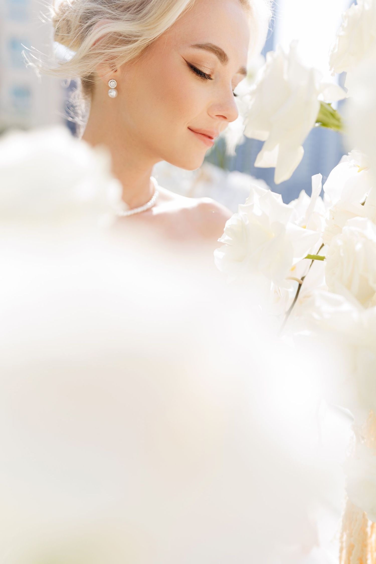 Ethereal bridal portrait with soft focus and dreamy lighting effects.