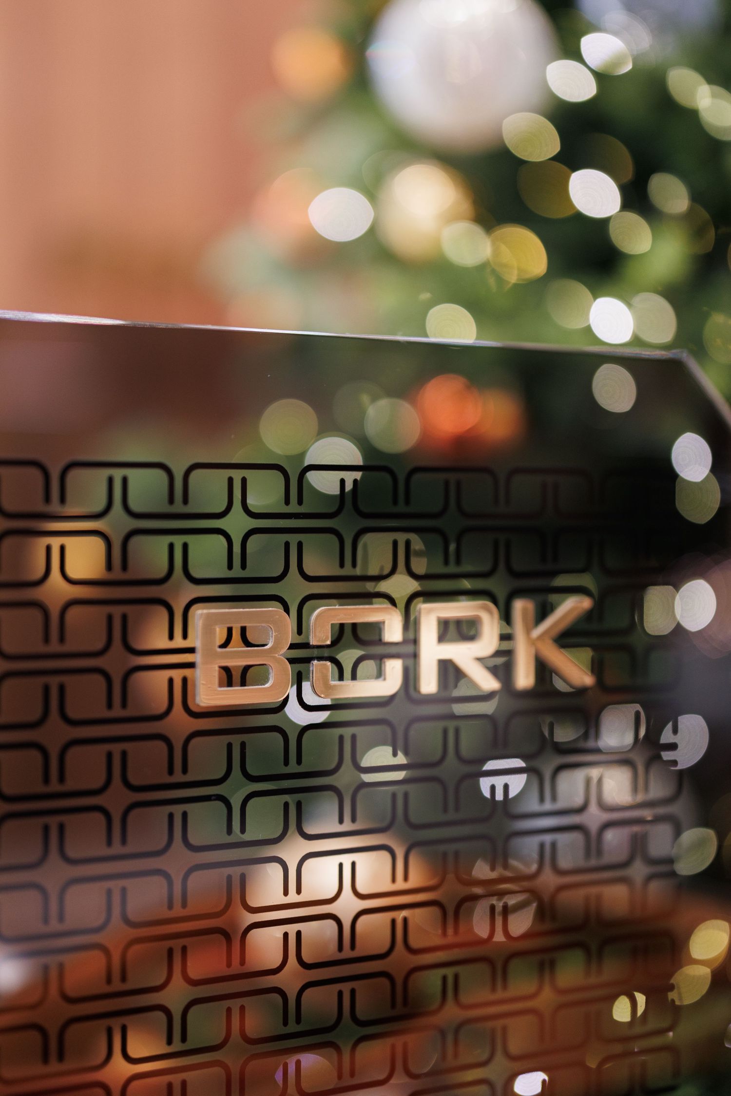 Abstract bokeh lights and decorative elements with text overlay in a retail setting.