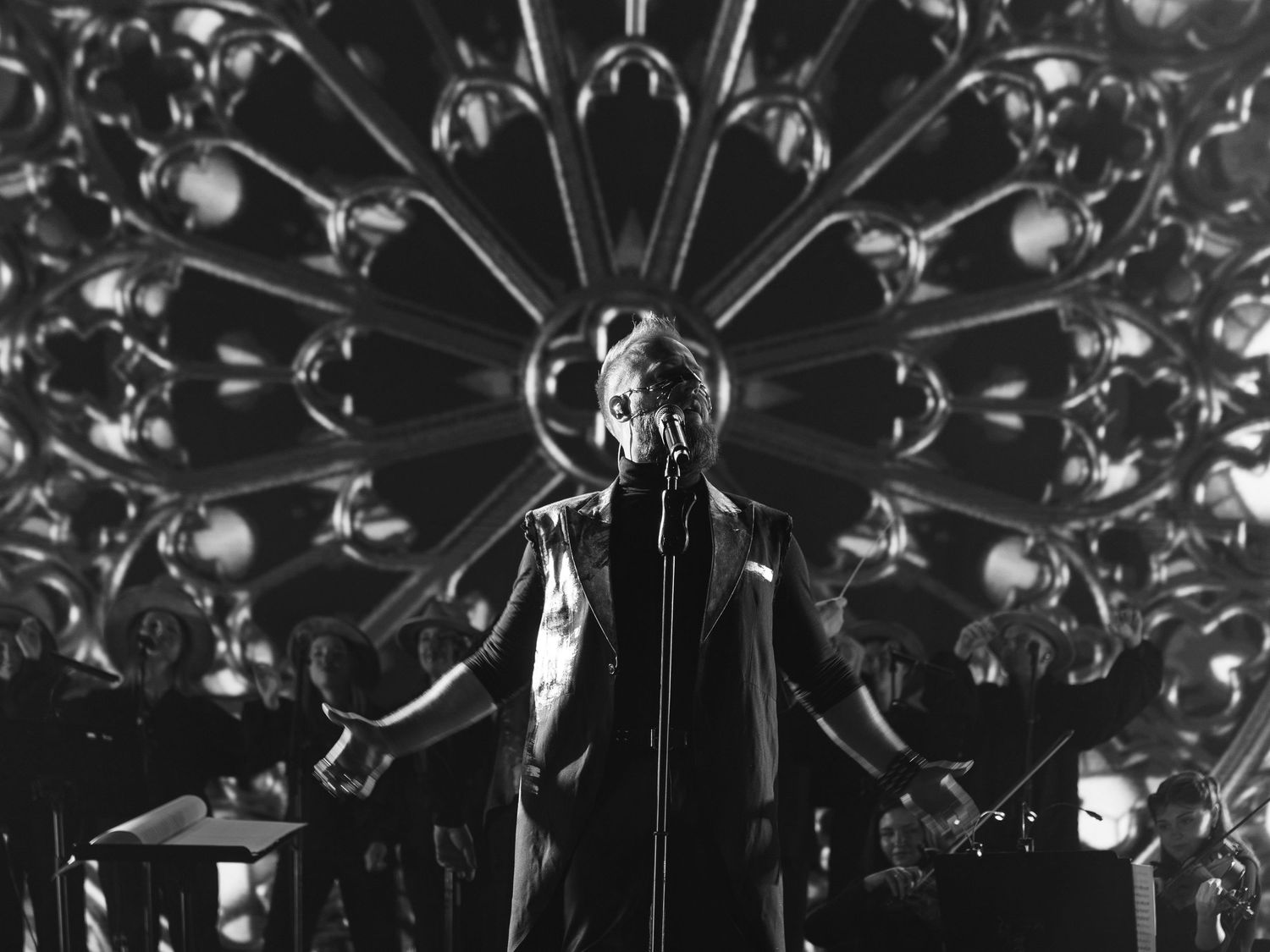 Crystal chandelier details shown in black and white with dramatic lighting and reflections.