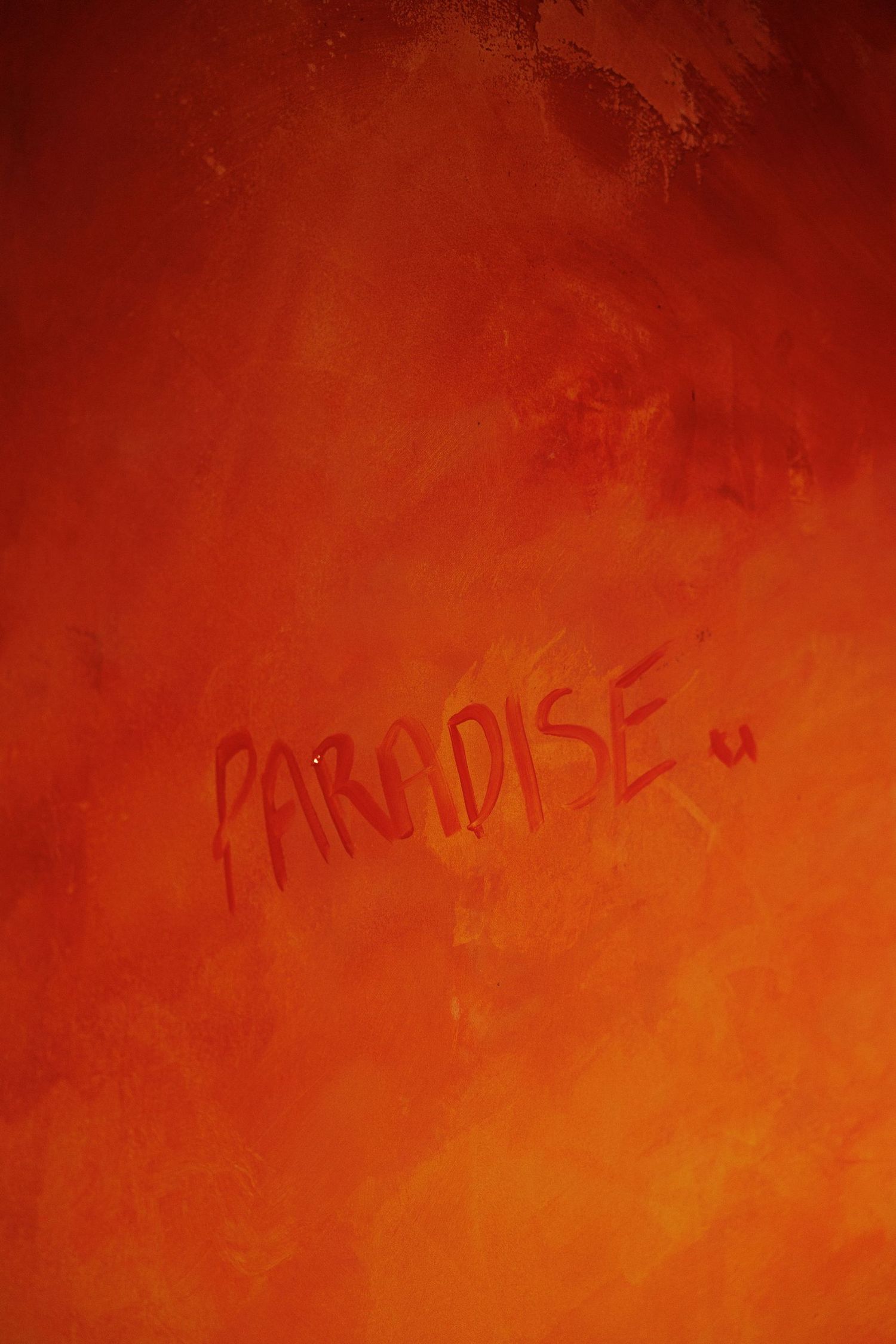 Abstract orange and red gradient background with faint text overlay.