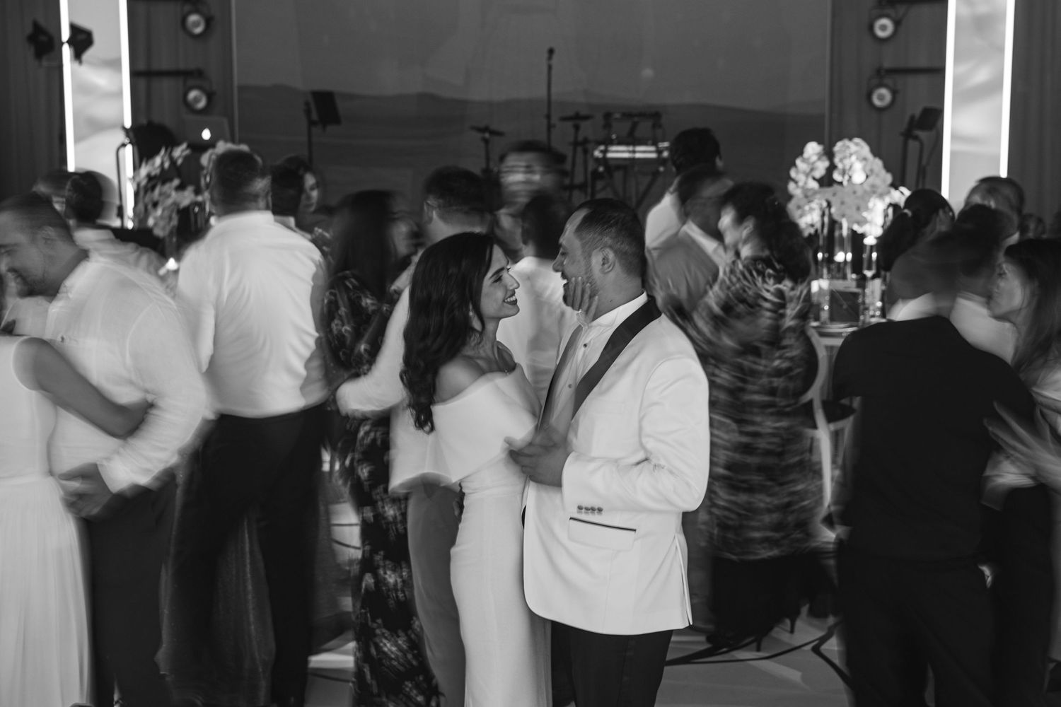 Wedding reception dance floor filled with guests enjoying the celebration.