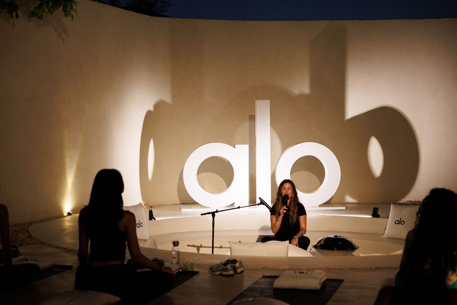 Artistic silhouette shots against light background with alo branding.