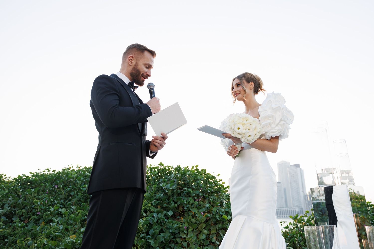 Candid moments captured during a rooftop wedding celebration.