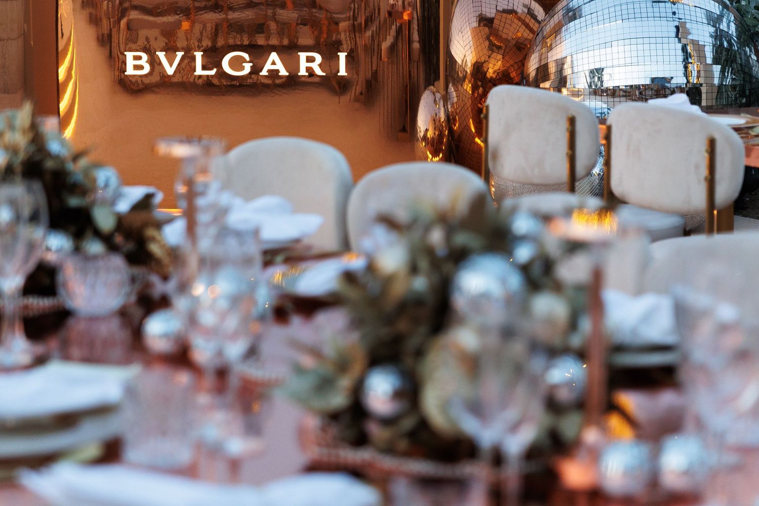 Elegant Bulgari branding signage displayed at an upscale venue with decorative lighting.