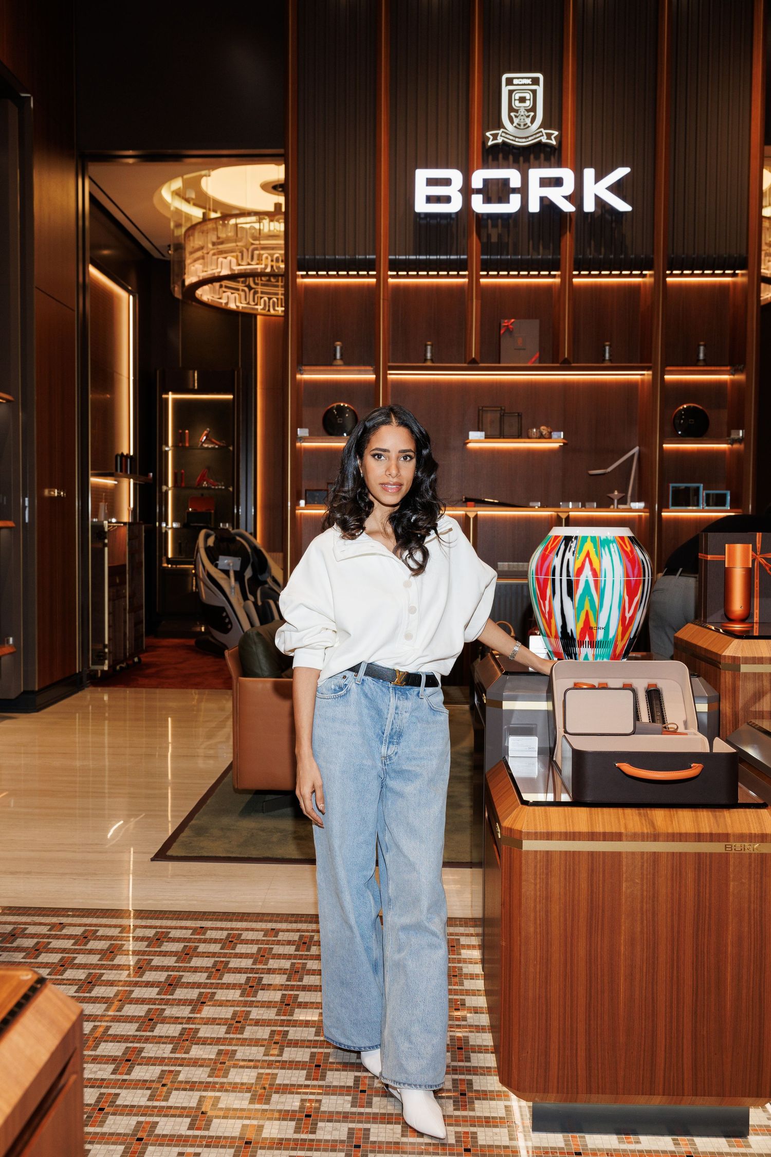 Modern retail interior with wood paneling and BORK signage showcasing stylish display area and tiled flooring.