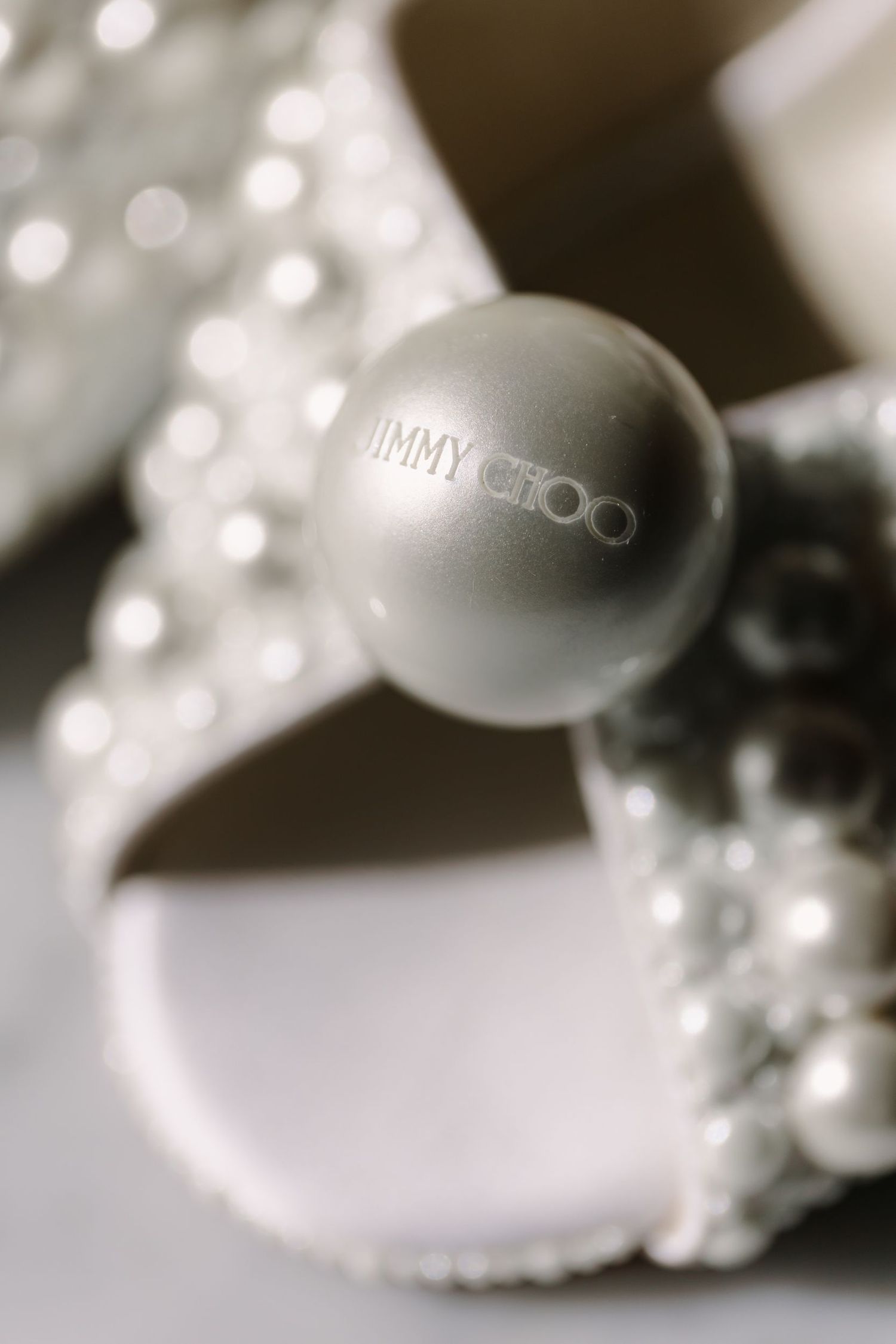 Artistic macro shot of luxury designer shoes with bokeh effect.
