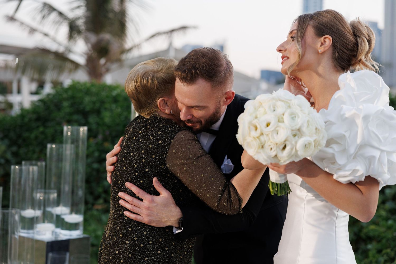Emotional moments shared between wedding guests during an evening celebration.