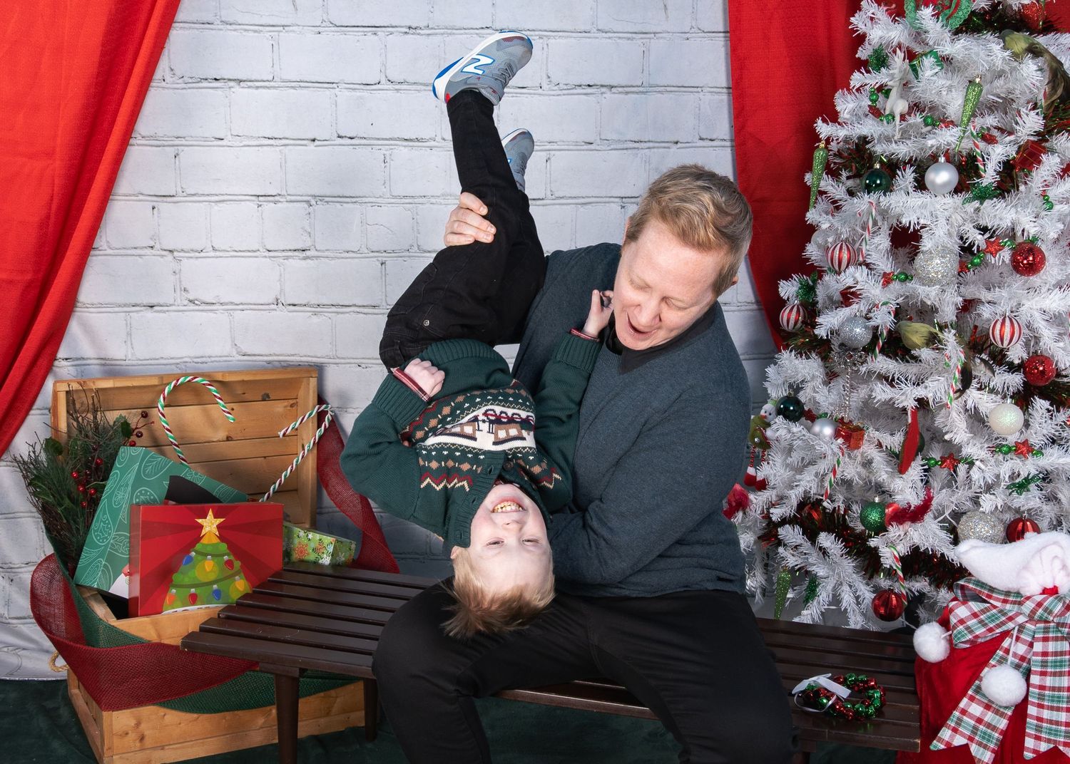 Family photo with a Christmas backdrop.