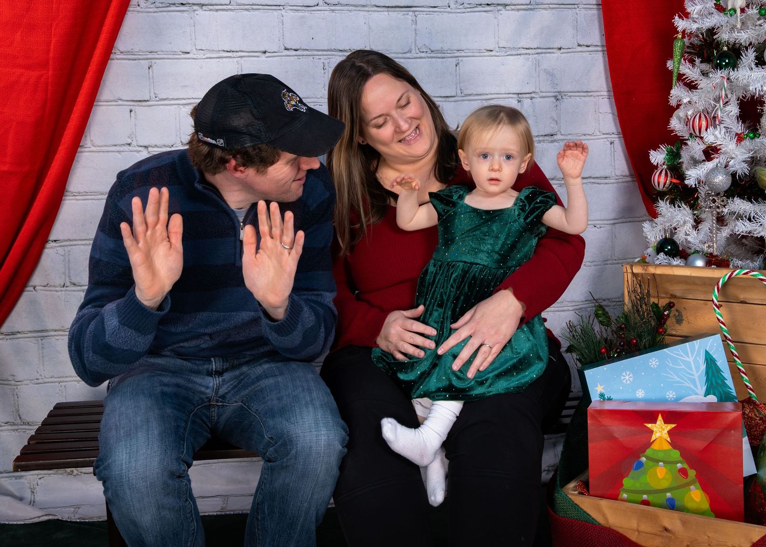 Family photo with a Christmas backdrop.