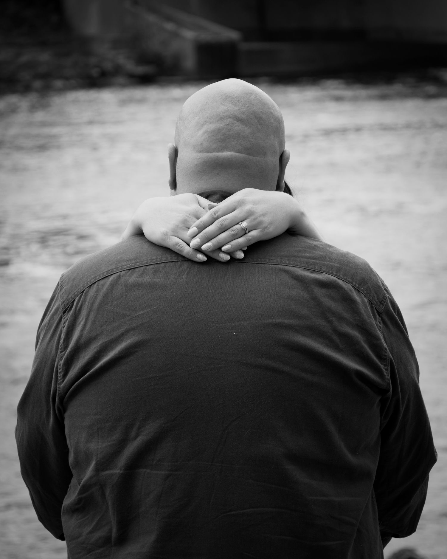 Black and white series showing intimate embraces and hand placement.