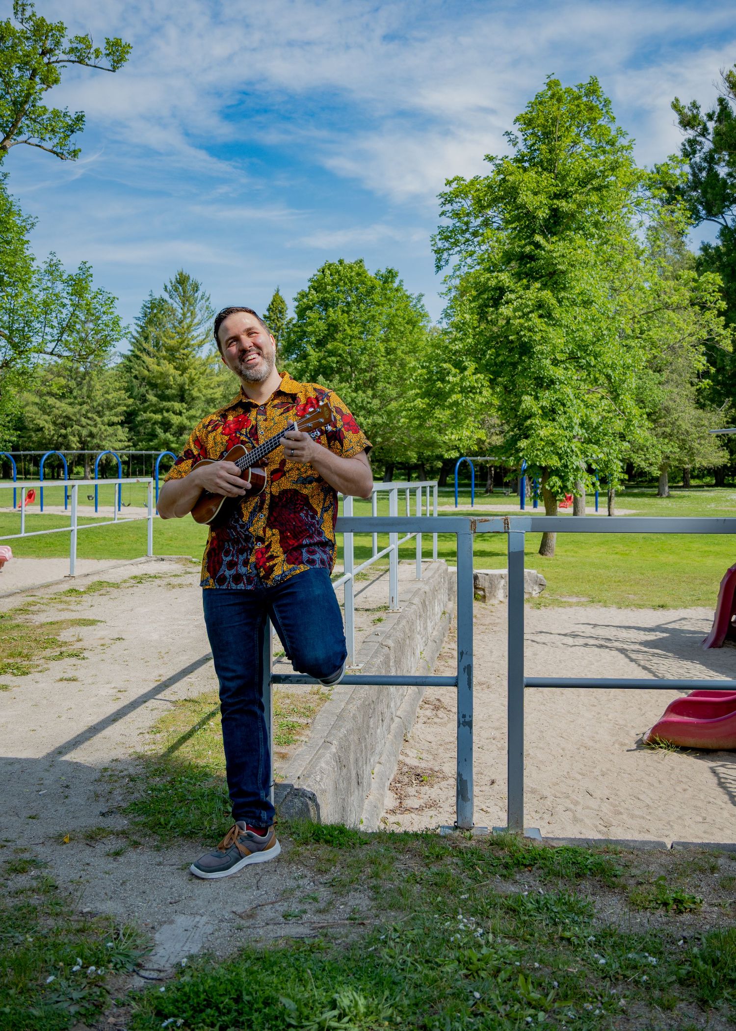Series of playful movements around metal park equipment in sunny outdoor setting.