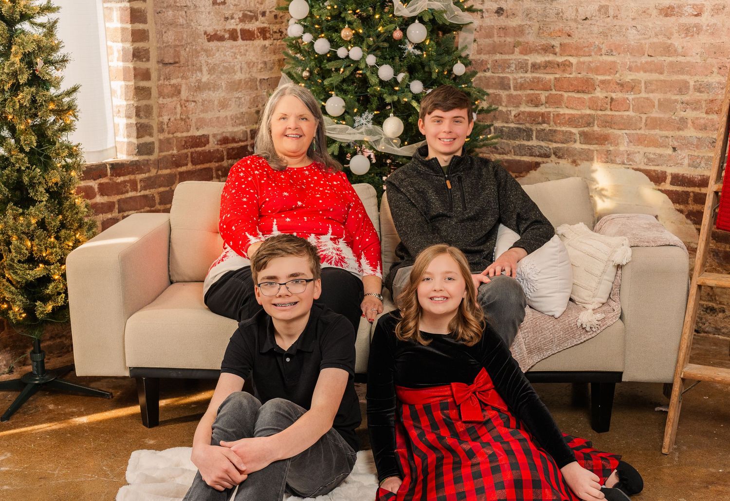 Greensboro, NC Family Photographer, Ryan Harden, Reidsville NC, grandmother and grandchildren pose in front of Christmas tree.