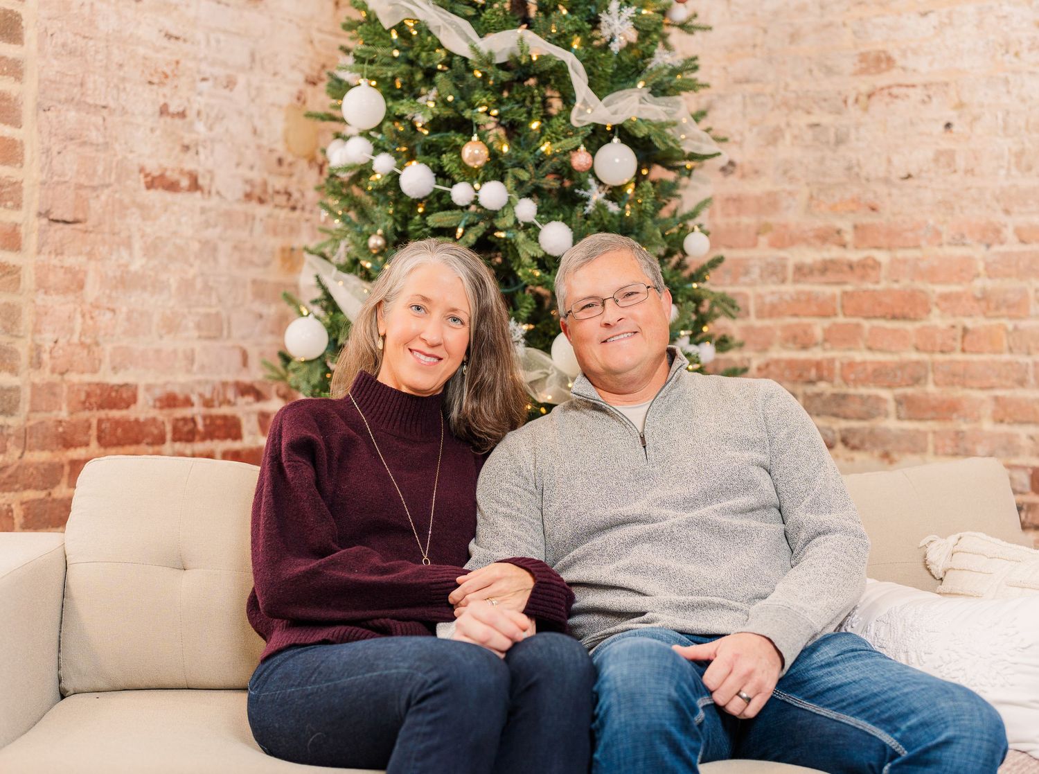 Greensboro, NC Couples Photographer, Ryan Harden, Reidsville NC, Happy couple poses in front of Christmas tree for seasonal session.