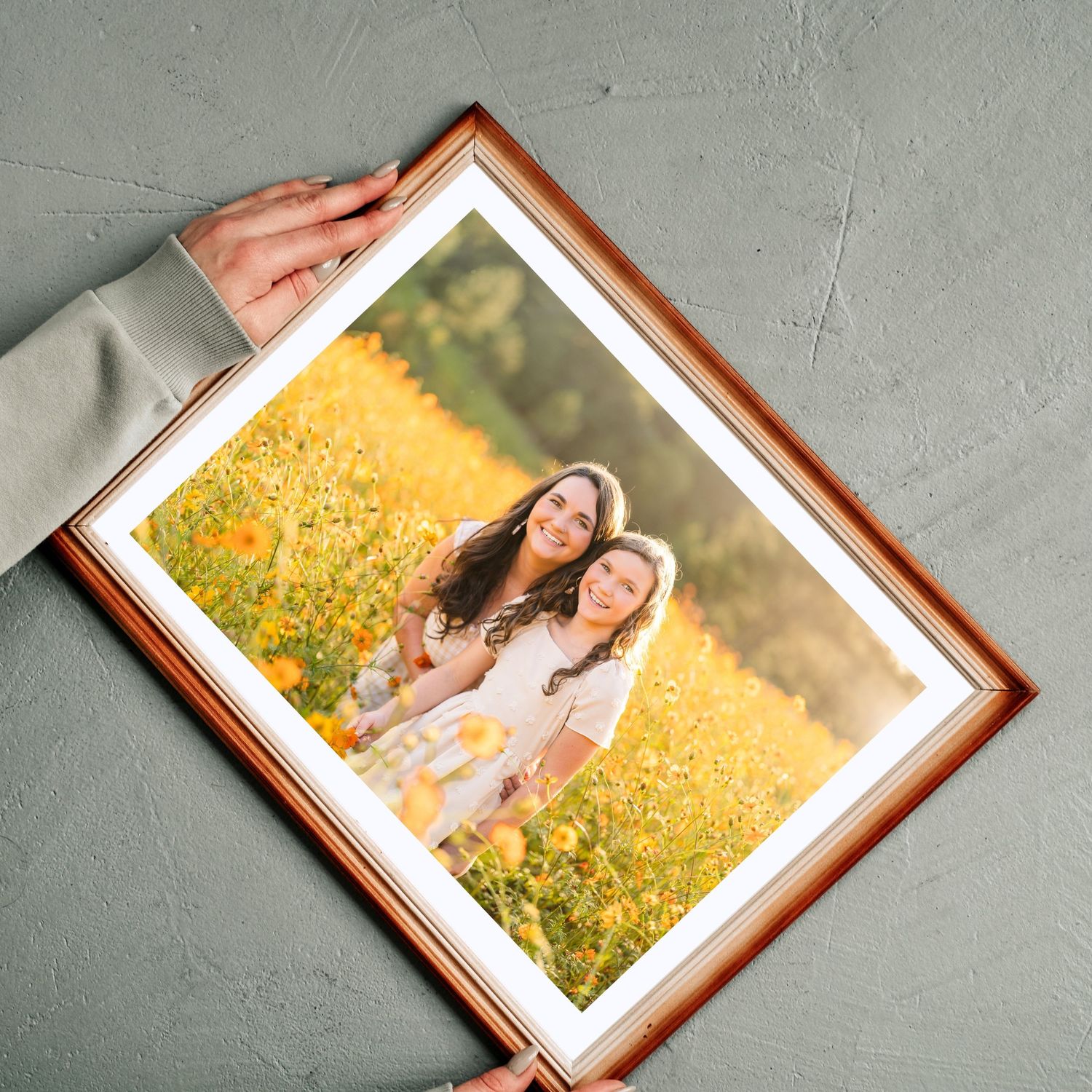 Greensboro, NC Family Photographer.  Ryan Harden.  Reidsville, NC.  Framed picture of mom and daughter in flower field at sunset.