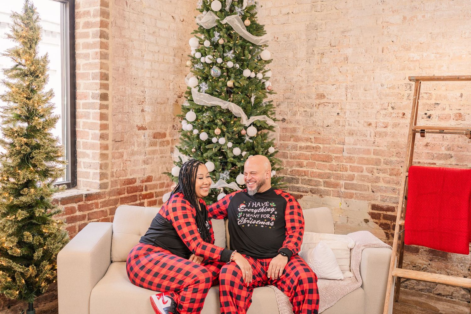 Greensboro, NC Couples Photographer, Ryan Harden, Reidsville NC, Happy couple poses in front of Christmas tree for seasonal session.