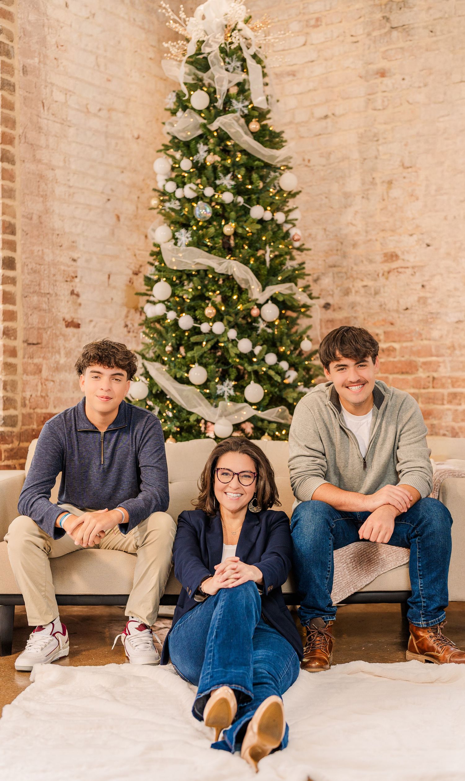 Greensboro, NC Family Photographer, Ryan Harden, Reidsville NC, mom and boys pose in front of Christmas tree for seasonal session.